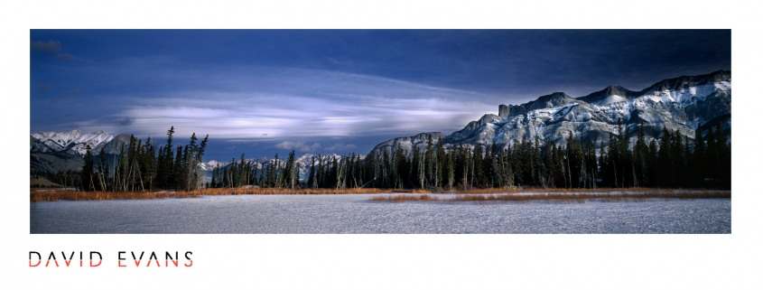 Panoramic photograph of Miette, Rocky Mountains, Canada in winter. Frozen lake with mountains and spectacular cloud formations. Panoramic prints, online landscape photography gallery, pictures of North America.